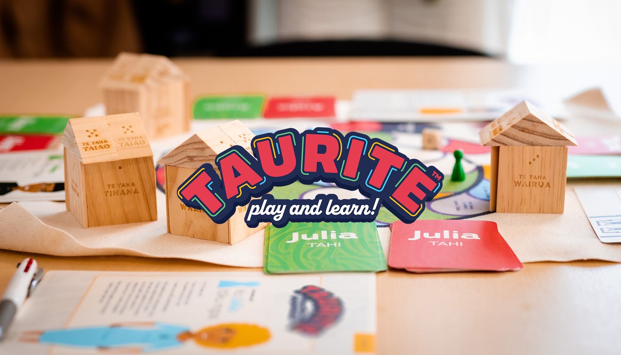 The Taurite logo with a picture of the board game behind.